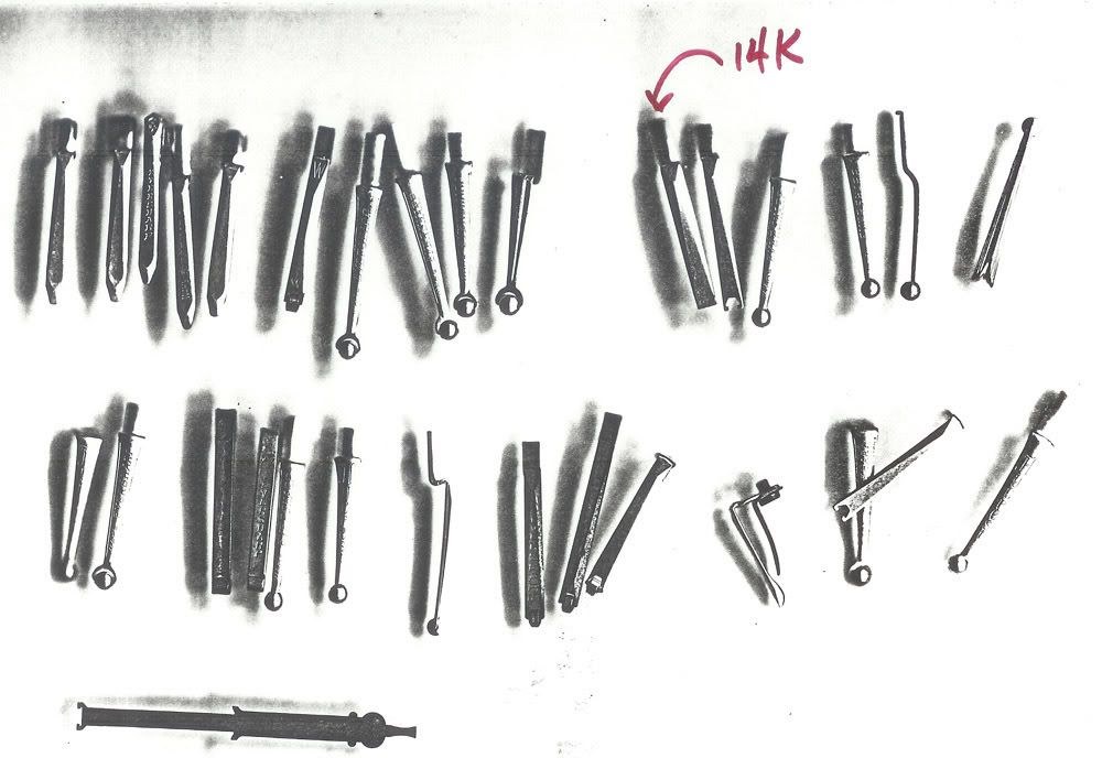 Rows of prototype parts and tools, one marked 14K and one a diamond-tipped dressing tool.
